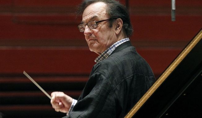 FILE - In this Oct. 19, 2011 file photo, chief conductor Charles Dutoit rehearses with the Philadelphia Orchestra in Philadelphia. Six more women have stepped forward to accuse the prominent conductor of sexually assaulting them in the United States, France and Canada, including a musician who says the maestro raped her in 1988. (AP Photo/Alex Brandon, File)