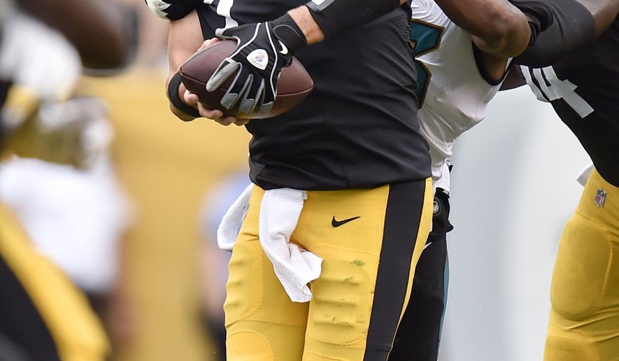 FILE - In this file photo from Oct. 8, 2017, Jacksonville Jaguars defensive end Dante Fowler (56) sacks Pittsburgh Steelers quarterback Ben Roethlisberger (7) in an NFL football game, in Pittsburgh. Three months later, Roethlisberger doesn&#39;t want to talk about that five-interception meltdown against Jacksonville, a shot at redemption awaits Sunday in the playoffs. (AP Photo/Don Wright, File)