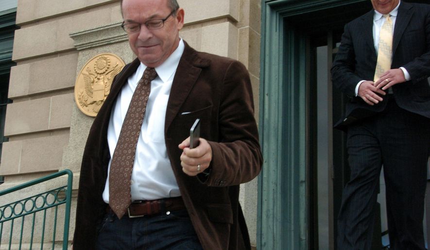 FILE - In this Nov. 3, 2014 file photo, Tim Blixseth, left, leaves a U.S. courthouse after facing questions about his finances in Butte, Mont. Former billionaire real estate developer Blixseth has reached a $3 million settlement to resolve claims he illegally pocketed hundreds of millions of dollars from a Montana resort for the superrich. (AP Photo/Matthew Brown, File)