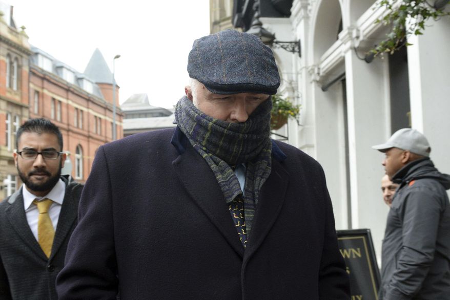 Specialist surgeon Simon Bramhall leaves Birmingham Crown Court in Birmingham, England, Friday, Jan. 12, 2018. A British surgeon who burned his initials into patients' livers during transplant operations has been fined 10,000 pounds ($13,600) and ordered to perform community service. Simon Bramhall pleaded guilty last month to two counts of assault, in a case a prosecutor called "without legal precedent in criminal law." (Joe Giddens/PA via AP)