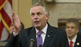 In this Jan. 10, 2018, file photo, then-Virginia Gov. Terry McAuliffe gestures as he addresses a joint session of the the 2018 session in the House chambers at the Capitol in Richmond, Va. (AP Photo/Steve Helber, File)