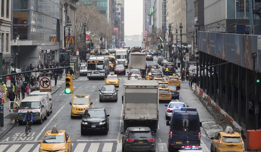In this Thursday, Jan. 11, 2018 photo, traffic is seen making it&#x27;s way across 42nd Street in New York. A proposal to make part Manhattan a toll zone, where drivers would be charged to drive into the most congested neighborhoods, is gaining momentum, despite continuing criticism from lawmakers representing car-heavy parts of Brooklyn and Queens. (AP Photo/Mary Altaffer)