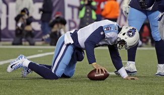 Tennessee Titans quarterback Marcus Mariota gets up from the turf after being sacked during the second half of an NFL divisional playoff football game against the New England Patriots, Saturday, Jan. 13, 2018, in Foxborough, Mass. (AP Photo/Steven Senne)