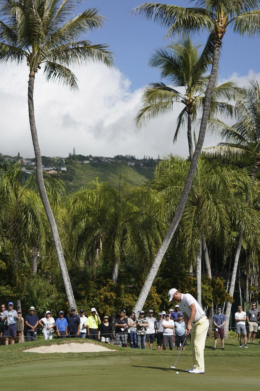 Justin Thomas putts on the third green during the final round of the Sony Open golf tournament, Sunday, Jan. 14, 2018, in Honolulu. (AP Photo/Marco Garcia)