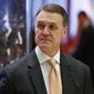 In this Dec. 2, 2016, file photo, Sen. David Perdue, R-Ga., walks to the elevator for a meeting with President-elect Donald Trump at Trump Tower, in New York. (AP Photo/Evan Vucci, File)