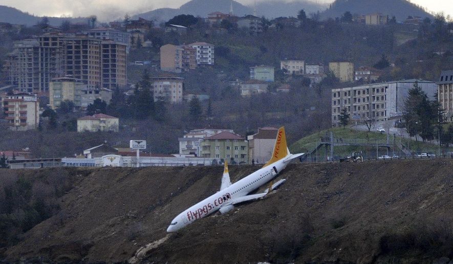 A Boeing 737-800 of Turkey&#x27;s Pegasus Airlines after skidding off the runway downhill towards the sea at the airport in Trabzon, Turkey, Sunday, Jan. 14, 2018. Trabzon Gov. Yucel Yavuz said all 162 passengers and crew on board were evacuated and safe early Sunday. The cause of the accident was not yet known. (DHA-Depo Photos via AP)