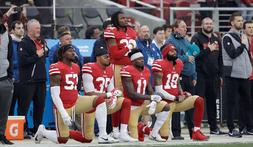 The San Francisco 49ers, who did not qualify for the NFL postseason, had only four players taking a knee during the national anthem by Week 17. Kneeling at Week 16 were (from left) Eli Harold, Eric Reid, Marquise Goodwin and Louis Murphy. (Associated Press/File)