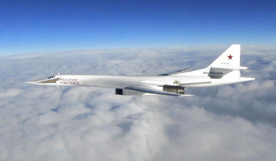 In this image made available by the Royal Air Force Monday, Jan. 15, 2018, one of Russian Blackjack Tupolev Tu-160 long-range bombers is photographed by an RAF aircraft, scrambled from RAF Lossiemouth, Scotland. The incident Monday is one of several in recent years as Russian military planes test NATO and British air defenses. (Royal Air Force via AP)