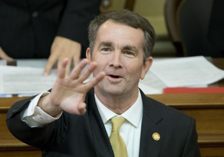 Virginia Gov. Ralph Northam waves to the gallery as he prepares to deliver his State of the Commonwealth address before a joint session of the Virginia General Assembly at the Capitol in Richmond, Va., Monday, Jan. 15, 2018. (AP Photo/Steve Helber) ** FILE **