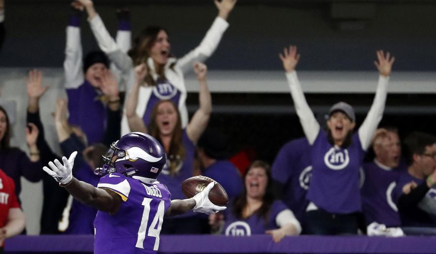 FILE - In this Sunday, Jan. 14, 2018, file photo, Minnesota Vikings wide receiver Stefon Diggs (14) celebrates in the end zone after a making the game-winning touchdown against the New Orleans Saints late the second half of an NFL divisional football playoff game in Minneapolis,. The Vikings defeated the Saints 29-24. (AP Photo/Jeff Roberson, File)
