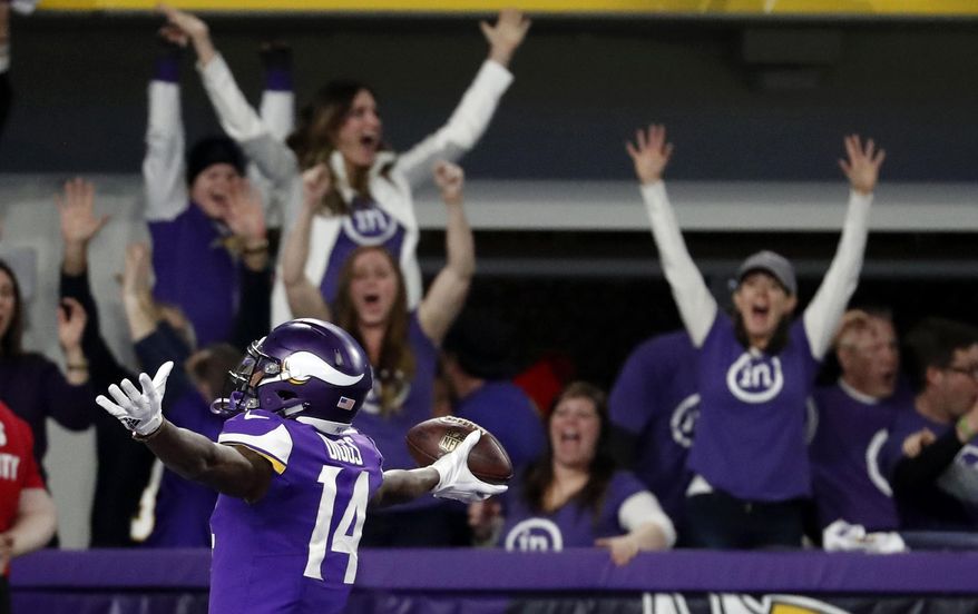 FILE - In this Sunday, Jan. 14, 2018, file photo, Minnesota Vikings wide receiver Stefon Diggs (14) celebrates in the end zone after a making the game-winning touchdown against the New Orleans Saints late the second half of an NFL divisional football playoff game in Minneapolis,. The Vikings defeated the Saints 29-24. (AP Photo/Jeff Roberson, File)