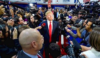 An aggressive press has been around for a while. Here, then-presidential hopeful Donald Trump faces a wall of journalists on the 2016 campaign trail. The relationship hasn&#39;t improved at all. (Associated Press)