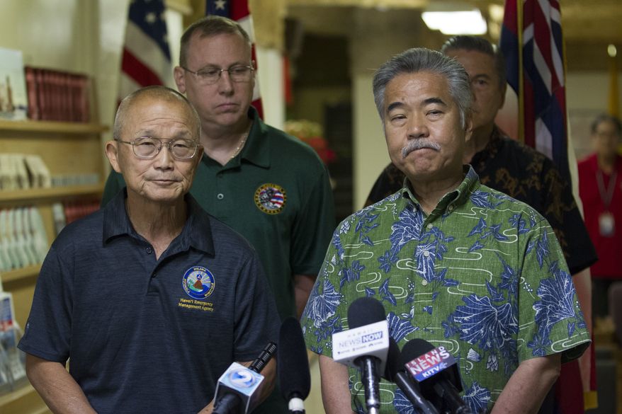 In this Saturday, Jan. 13, 2018, file photo, Vern Miyagi, Administrator, HEMA, left, and Hawaii Gov. David Ige addressed the media during a press conference at the Hawaii Emergency Management Center at Diamond Head Saturday following the false alarm issued of a missile launch on Hawaii. Gov. Ige has appointed state Army National Guard Brig. Gen. Kenneth Hara as new head of Hawaii's emergency management agency after a faulty alert was sent to cellphones around the state warning of an incoming missile attack. (George F. Lee/The Star-Advertiser via AP, file)