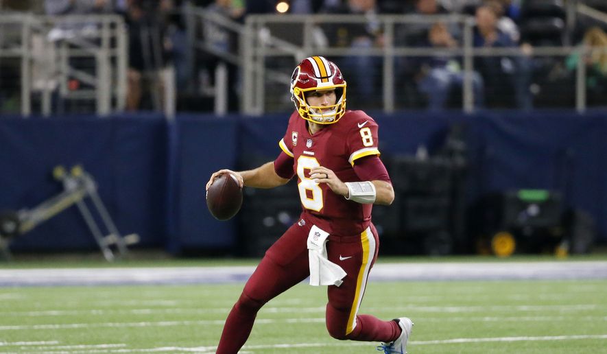 Washington Redskins quarterback Kirk Cousins (8) rolls out of the pocket to pass during an NFL football game against the Dallas Cowboys on Thursday, Nov. 30, 2017, in Arlington, Texas. (AP Photo/Roger Steinman) ** FILE **