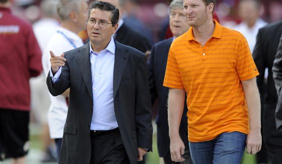 FILE - In this Aug. 29, 2012, file photo, Washington Redskins owner Dan Snyder, left, walks with NASCAR driver Dale Earnhardt Jr., on the field before an NFL preseason football game against the Tampa Bay Buccaneers, in Landover, Md. Earnhardt has never attended a Super Bowl, but is a rabid Redskins fan. Earnhardt will be part of the network&#39;s pregame show before the Super Bowl, then head to South Korea for NBC Sports&#39; coverage of next month&#39;s Olympics. (AP Photo/Nick Wass, File)