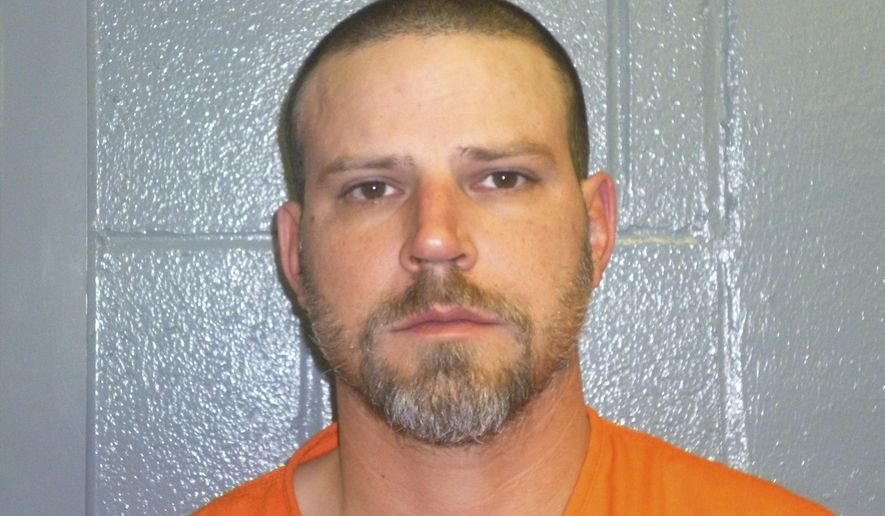 File - This Dec. 9, 2015, booking photo provided by the Custer County, Okla., Sheriff's Office shows Jeremy Doss Hardy. Hardy's murder trial began Tuesday, Jan. 16, 2018, in Arapaho, Okla. He is charged with two counts of first-degree murder, assault with a dangerous weapon and other offenses. Prosecutors are seeking the death penalty. Investigators say Hardy fired randomly at vehicles along Interstate 40 in western Oklahoma on Dec. 16, 2015. (Custer County Sheriff's Office via AP, File)