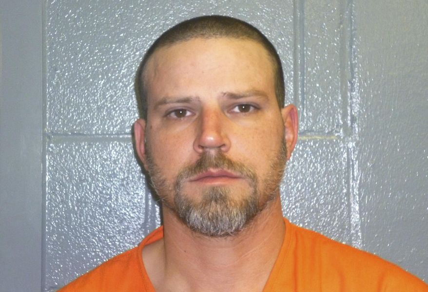 File - This Dec. 9, 2015, booking photo provided by the Custer County, Okla., Sheriff's Office shows Jeremy Doss Hardy. Hardy's murder trial began Tuesday, Jan. 16, 2018, in Arapaho, Okla. He is charged with two counts of first-degree murder, assault with a dangerous weapon and other offenses. Prosecutors are seeking the death penalty. Investigators say Hardy fired randomly at vehicles along Interstate 40 in western Oklahoma on Dec. 16, 2015. (Custer County Sheriff's Office via AP, File)