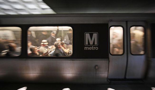 A Metro train departs the Gallery Place-Chinatown Metro Station, Thursday, Jan. 11, 2018, in Washington. Washington&#x27;s Metro system has become internationally synonymous with delays, breakdowns and smoke-filled tunnels. (AP Photo/Alex Brandon) ** FILE **