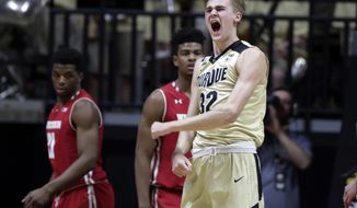 Purdue forward Matt Haarms (32) celebrates in the first half of an NCAA college basketball game against Wisconsin in West Lafayette, Ind., Tuesday, Jan. 16, 2018. (AP Photo/Michael Conroy)