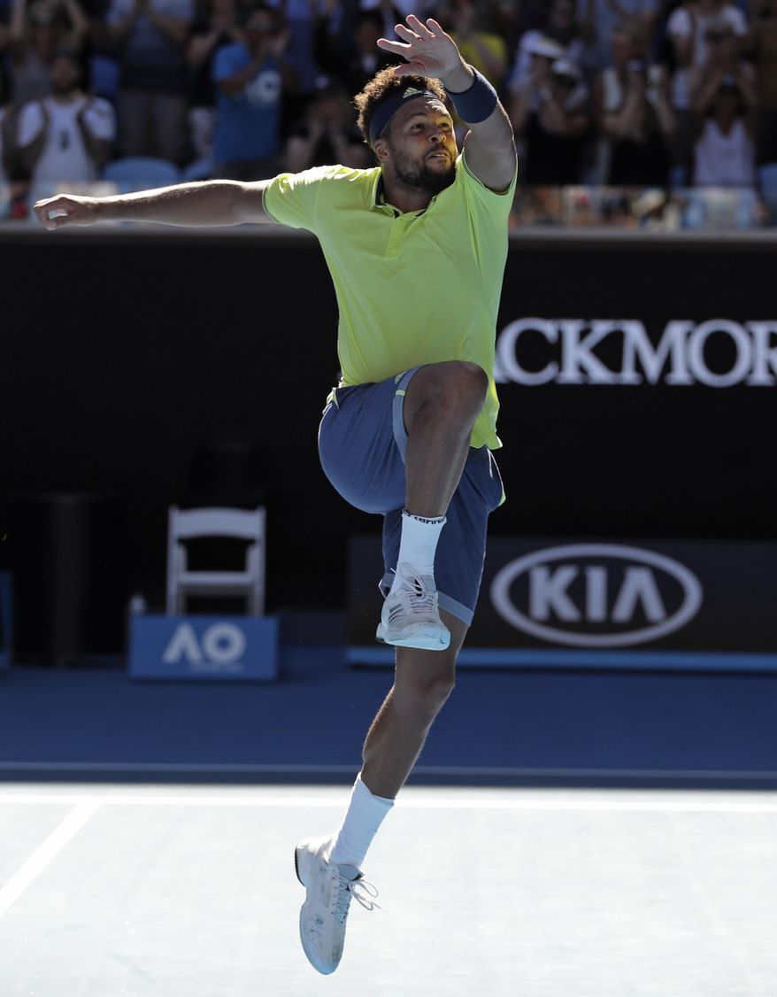 France&#39;s Jo-Wilfried Tsonga celebrates his win over Canada&#39;s Denis Shapovalov during their second round match at the Australian Open tennis championships in Melbourne, Australia, Wednesday, Jan. 17, 2018. (AP Photo/Dita Alangkara)