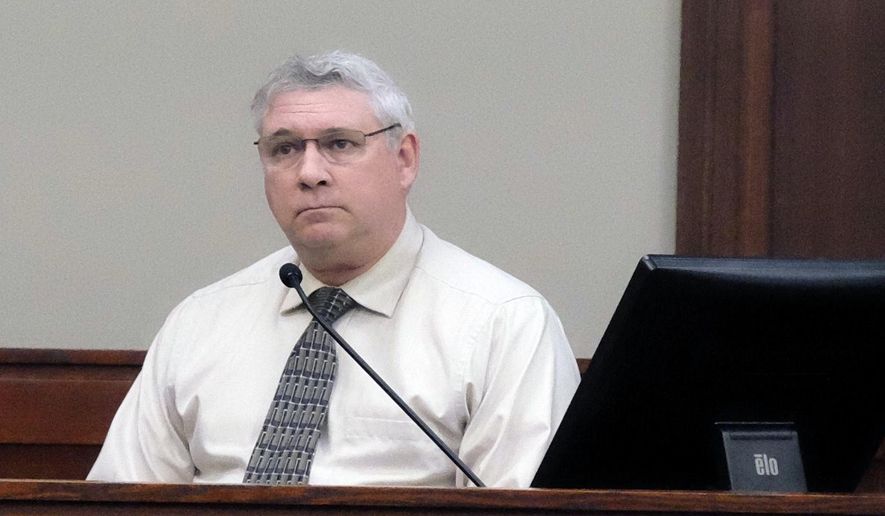 Jeffrey Howenstine listens in Ingham County Circuit Court, Wednesday, Jan. 17, 2018 in Lansing, Mich. The former Michigan middle school band teacher acquitted in 2002 of sexual conduct involving a student has pleaded guilty in a separate case to attempting to engage a minor for prostitution. (Christopher Haxel/Lansing State Journal via AP)