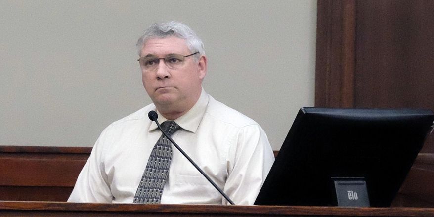 Jeffrey Howenstine listens in Ingham County Circuit Court, Wednesday, Jan. 17, 2018 in Lansing, Mich. The former Michigan middle school band teacher acquitted in 2002 of sexual conduct involving a student has pleaded guilty in a separate case to attempting to engage a minor for prostitution. (Christopher Haxel/Lansing State Journal via AP)