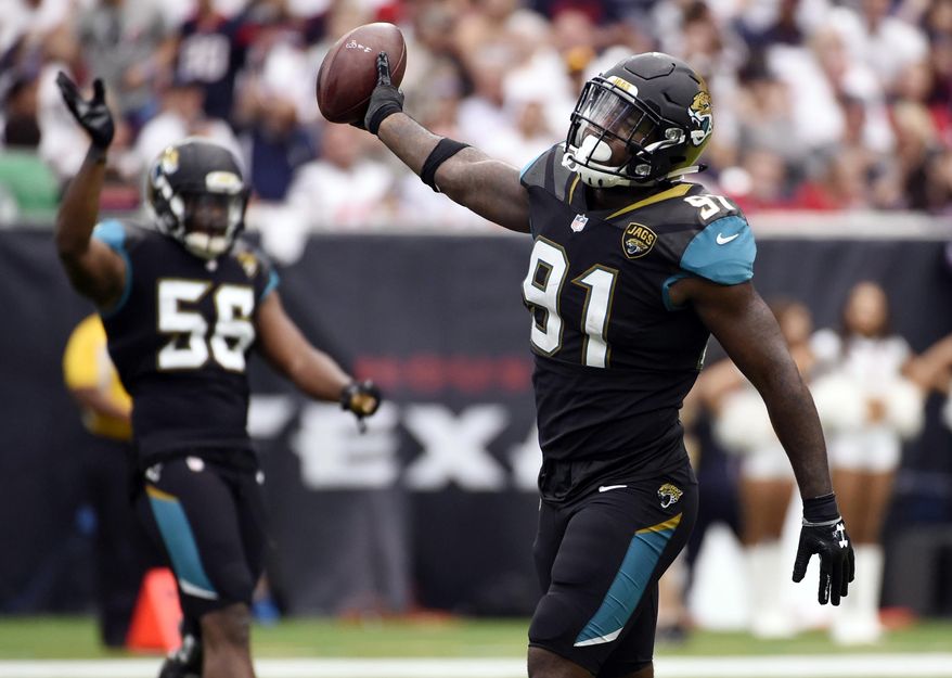 FILE- In this Sept. 10, 2017, file photo, Jacksonville Jaguars defensive end Yannick Ngakoue (91) celebrates after he recovered a fumble by Houston Texans quarterback Deshaun Watson during the second half of an NFL football game in Houston. The second-year pro led the NFL with six forced fumbles in the regular season and added another one last week at Pittsburgh. Ngakoue would love to add New England's Tom Brady to his growing resume in the AFC championship game. (AP Photo/Eric Christian Smith, File) **FILE**