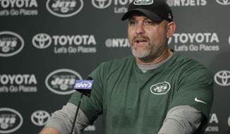 FILE - In this Tuesday, May 23, 2017 file photo, New York Jets offensive coordinator John Morton talks to reporters during the team&#39;s organized team activities at its NFL football training facility in Florham Park, N.J. A person with direct knowledge of the decision says the New York Jets have fired offensive coordinator John Morton after one season. The person spoke to The Associated Press on Wednesday, Jan. 17, 2018 on condition of anonymity because the team had not announced the move.(AP Photo/Julio Cortez, File)
