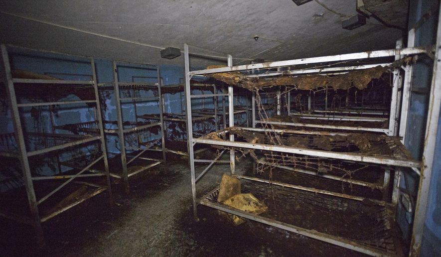 In this Tuesday, Sept. 26, 2017 photo, a bay of bunkbeds can be seen in a crescent shaped room inside a Cold War era Civil Defense bunker in New Orleans. A generation of Americans knew just what to do in the event of a nuclear attack - or during a major false alarm, like the one over the weekend in Hawaii. Take cover in a building bearing a yellow fallout shelter symbol. But these days, that might not be the best option, or even an option at all. (Max Becherer /The Advocate via AP)