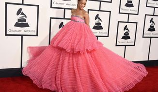 In this Feb. 8, 2015 file photo, Rihanna arrives at the 57th annual Grammy Awards in a two-tiered pink Giambattista Valli dress in Los Angeles. (Photo by Jordan Strauss/Invision/AP)