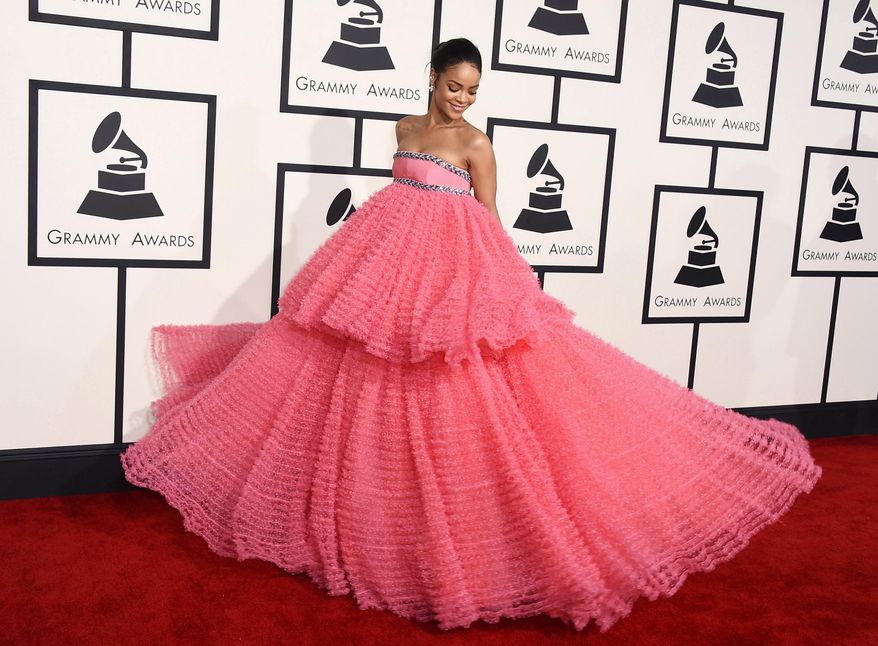 In this Feb. 8, 2015 file photo, Rihanna arrives at the 57th annual Grammy Awards in a two-tiered pink Giambattista Valli dress in Los Angeles. (Photo by Jordan Strauss/Invision/AP)