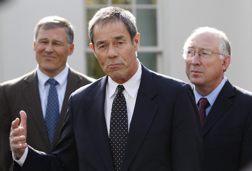 FILE - In this Nov. 2, 2009 file photo, former Alaska Gov. Tony Knowles, center, accompanied by Rep. Jay Inslee, D-Wash., left, and Interior Secretary Ken Salazar, gestures while speaking to members of the media following their meeting at the White House in Washington. A U.S. Interior Department official has reacted harshly to the resignation of most members of a board that advises it on national parks. Knowles chaired the congressionally authorized board until Tuesday, Jan. 16, 2018, the Democrat and eight others on the 12-member board sent a resignation letter, saying their requests to meet as prescribed in law have been disregarded. (AP Photo/Pablo Martinez Monsivais,File)