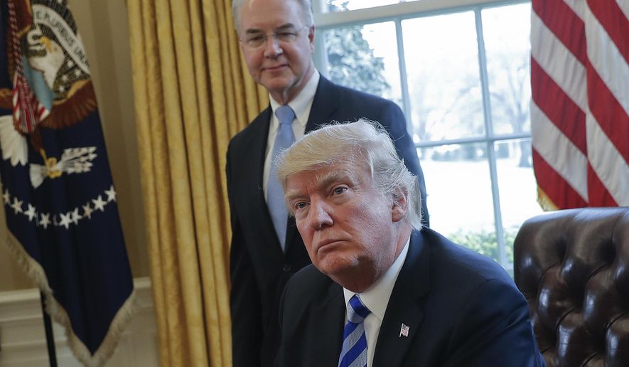 FILE - In this March 24, 2017, file photo, President Donald Trump with Health and Human Services Secretary Tom Price are seen in the Oval Office of the White House in Washington.  (AP Photo/Pablo Martinez Monsivais, File)