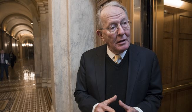 Sen. Lamar Alexander, R-Tenn., chairman of the Senate Health, Education, Labor, and Pensions Committee, pauses for a reporter&#x27;s question at the Capitol in Washington on Jan. 18, 2018. (Associated Press) **FILE**