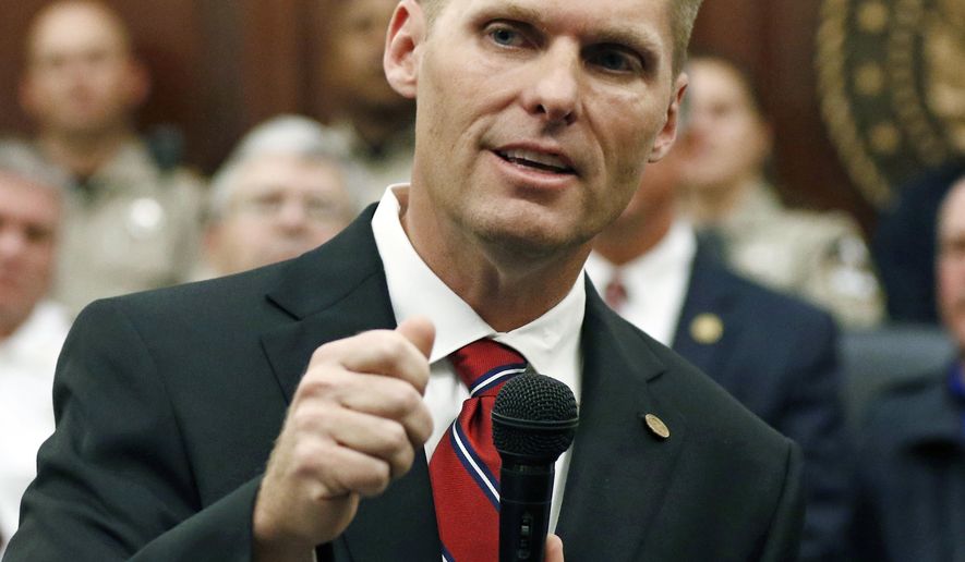 Michael Guest, district attorney for Madison and Rankin Counties, officially announces, Thursday, Jan. 18, 2018 at the Rankin County Courthouse in Brandon, Miss., that he is seeking the seat for Mississippi's 3rd Congressional District as a Republican. Guest has served as district attorney since 2008. U.S. Rep. Gregg Harper, R-Miss., has announced he is not seeking reelection. (AP Photo/Rogelio V. Solis)