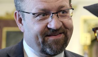 In this file photo dated Tuesday, May 2, 2017, Deputy assistant to President Trump, Sebastian Gorka talks with people in the Treaty Room in the Eisenhower Executive Office Building of the White House complex in Washington, USA. (AP Photo/Susan Walsh, FILE)