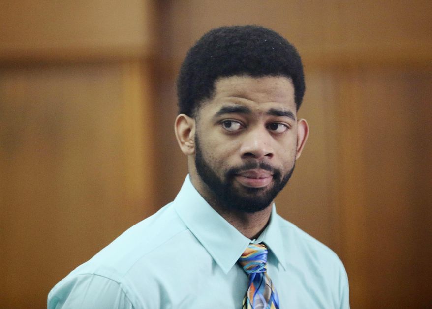 FILE - In this June 20, 2017, file photo, former Milwaukee police officer Dominique Heaggan-Brown appears in Milwaukee County Court in Milwaukee. Heaggan-Brown, who was acquitted of fatally shooting a black man, sparking two nights of riots, pleaded guilty, Thursday, Jan. 18, 2018, to lesser charges in sexual assault cases that had gotten him fired. (Michael Sears/Milwaukee Journal-Sentinel via AP, Pool, File)