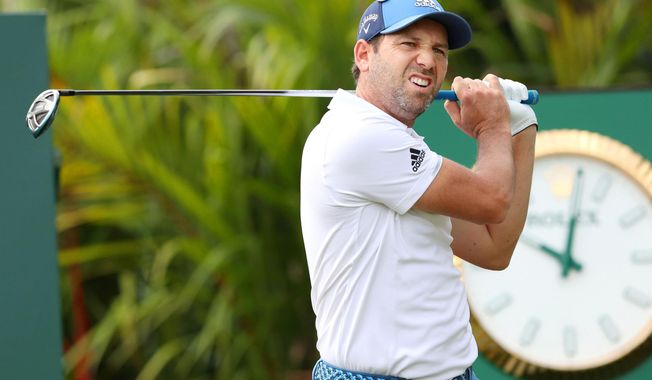 In this Wednesday, Jan. 17, 2018, photo, Spain&#x27;s Sergio Garcia practices for the Singapore Open golf tournament in Singapore. Garcia kicked off his 2018 season in style on Thursday, Jan. 18, 2018, shooting a 5-under 66 to take a two-stroke lead after the first round of the Singapore Open. (Kyodo News via AP)