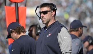 FILE - In this Dec. 17, 2017, file photo, Houston Texans defensive coordinator Mike Vrabel watches from the sideline during the first half of an NFL football game against the Jacksonville Jaguars, in Jacksonville, Fla. The Tennessee Titans have finished interviewing Houston defensive coordinator Mike Vrabel, the first candidate for their head coach opening. The Titans announced they concluded the interview early Thursday afternoon, Jan. 18, 2018. Tennessee is looking to replace Mike Mularkey, fired Monday after he went 21-22 and won the franchise’s first playoff game in 14 years. Vrabel is coming off his first season as defensive coordinator for the Texans. (AP Photo/Phelan M. Ebenhack, File)