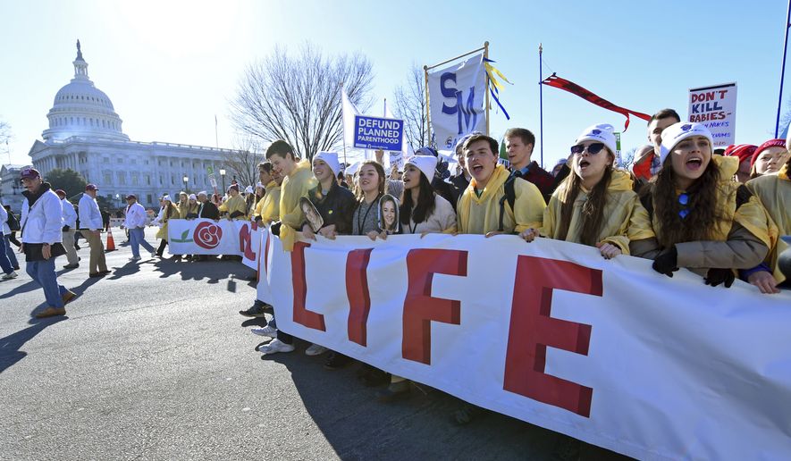 People participate in the March for Life on Capitol Hill in Washington, Friday, Jan. 19, 2018. (AP Photo/Susan Walsh) ** FILE **