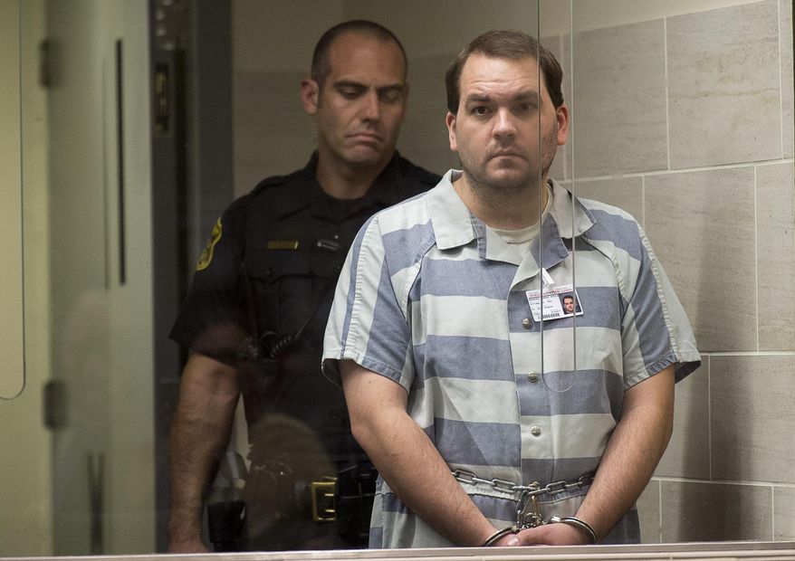 FILE - In this Sept. 18, 2017 file pool photo, Robert William Hodges is arraigned in connection with the deaths of his three children, Kelvin, 11, Julie, 9, and Lucas, nearly 8 months, in Yolo County Superior Court, in Woodland, Calif. Hodges was sentenced to three life terms in prison under a plea agreement, Friday Jan. 19, 2018. (Paul Kitagaki Jr./The Sacramento Bee via AP, Pool, File)