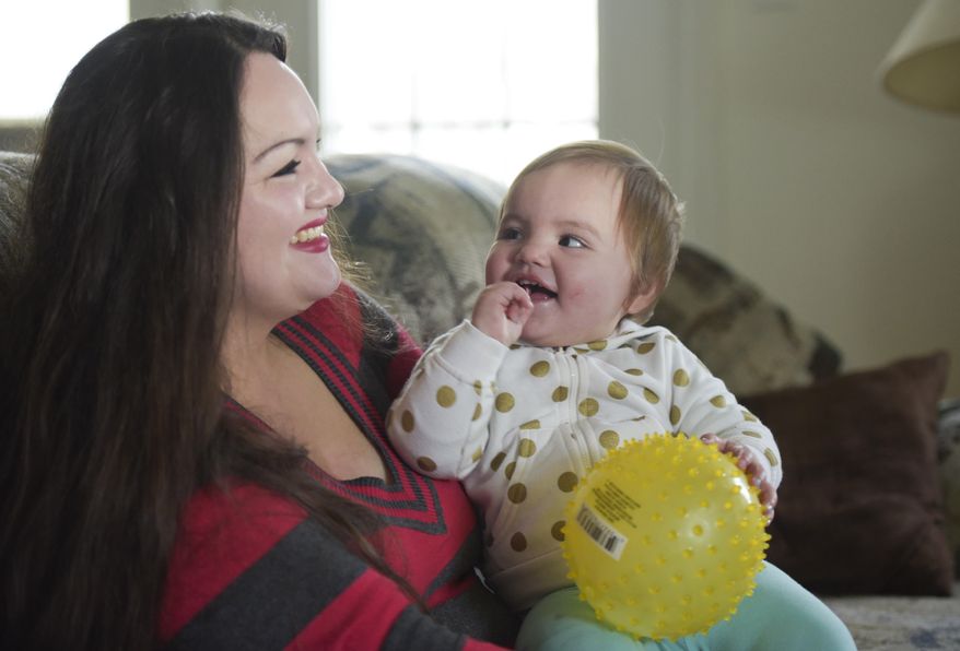 In this Thursday, Jan. 11, 2018 photo, Victoria Williams shares a laugh with her daughter, Victoria Hernandez, 1, at their residence in Nampa, Idaho. If you had met Williams a few years ago, you would not recognize her as the woman she is today. (Chris Bronson/The Idaho Press-Tribune via AP)