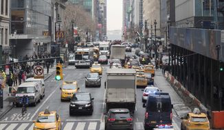 In this Jan. 11, 2018 file photo, traffic makes its way across 42nd Street in New York City. (AP Photo/Mary Altaffer, File)  **FILE**