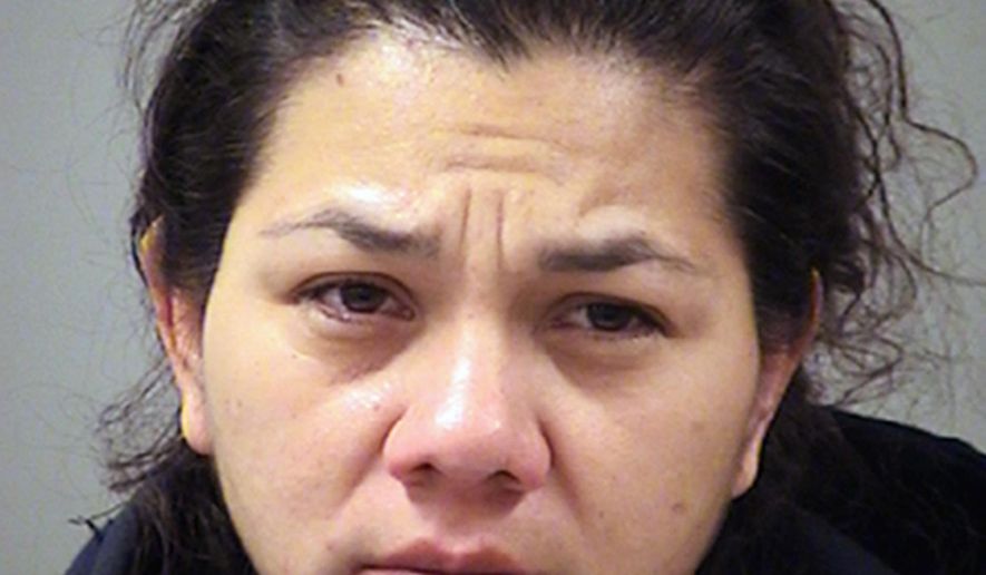 This photo provided by the Bexar County Sheriff's Office in San Antonio, Texas shows San Antonio police Officer Stephanie Solis who was arrested Thursday, Jan. 18, 2018, and has been charged with theft after allegedly shoplifting at a mall. Solis has been put on administrative leave amid the investigation. (Bexar County Sheriff's Office via AP)
