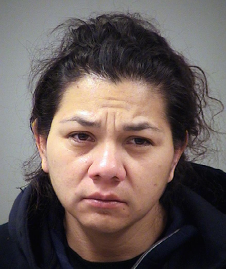 This photo provided by the Bexar County Sheriff's Office in San Antonio, Texas shows San Antonio police Officer Stephanie Solis who was arrested Thursday, Jan. 18, 2018, and has been charged with theft after allegedly shoplifting at a mall. Solis has been put on administrative leave amid the investigation. (Bexar County Sheriff's Office via AP)