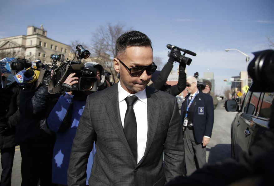Michael "The Situation" Sorrentino, one of the former stars of the "Jersey Shore" reality TV show, is swarmed by reporters while leaving the Martin Luther King, Jr., Federal Courthouse after a hearing, Friday, Jan. 19, 2018, in Newark, N.J. Sorrentino pleaded guilty to one count of tax evasion and admitted concealing his income in 2011 by making cash deposits in amounts that wouldn't trigger federal reporting requirements. He and his brother, Marc, were charged in 2014 and again last year with multiple counts related to nearly $9 million in income from the show. (AP Photo/Julio Cortez)