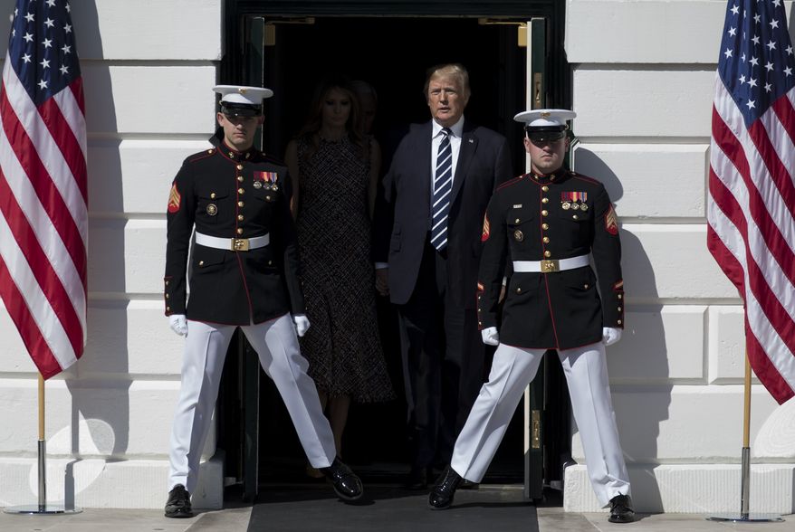 President Donald Trump and first lady Melania Trump walk from the White House in Washington, Monday, Oct. 2, 2017, to the South Lawn for a moment of silence to remember the victims of the mass shooting in Las Vegas. (AP Photo/Carolyn Kaster, File)