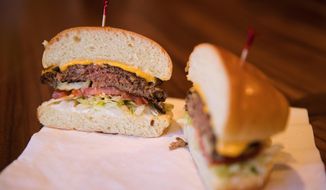 In a Tuesday, Jan 9, 2018 photo, the Impossible Burger is show at Stella&#x27;s, in Bellevue, Neb. The burger is made from plant protein. (Ryan Soderlin/The World-Herald via AP)