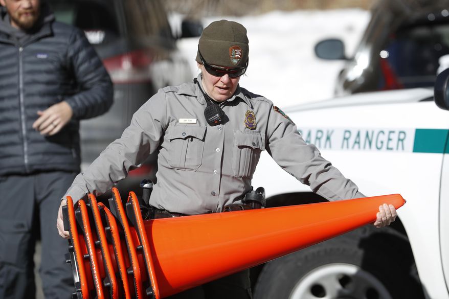 Rocky Mountain National Park Ranger Amy Fink and other critical staff members continued to work as open-air national parks and monuments remained open to visitors during the government shutdown. (Associated Press)
