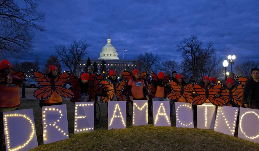 Demonstrators rally in support of Deferred Action for Childhood Arrivals (DACA) outside the Capitol, Sunday, Jan. 21, 2018, in Washington, on the second day of the federal shutdown. Democrats have been seeking a deal to protect the "Dreamers," who have been shielded against deportation by DACA, which President Donald Trump halted last year. (AP Photo/Jose Luis Magana)